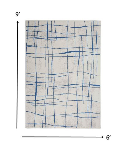 6' X 9' Ivory And Blue Geometric Distressed Area Rug