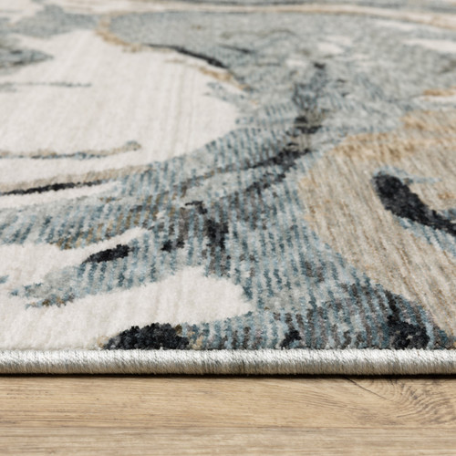 5' X 8' Blue Black And Ivory Abstract Area Rug With Fringe