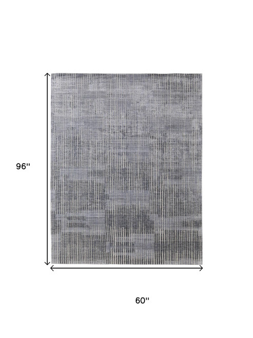 5' X 8' Blue Ivory And Gray Abstract Hand Woven Distressed Area Rug