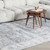 5' X 8' Blue Ivory and Brown Oriental Area Rug