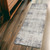 2' X 6' Navy And Beige Distressed Vines Area Rug