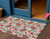 3' X 5' Beige Red Black Pink And Brown Floral Washable Indoor Outdoor Area Rug