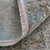 10' Ivory Gray and Blue Abstract Power Loom Runner Rug With Fringe