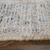 5' X 8' Tan and Gray Oriental Hand Woven Distressed Area Rug With Fringe