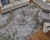 7' X 10' Gray Silver and Green Ikat Power Loom Area Rug With Fringe