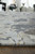 5' X 8' Ivory Taupe and Green Abstract Hand Tufted Worn Faded Area Rug