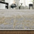 8' X 10' Ivory Gray and Brown Abstract Power Loom Worn Faded Area Rug