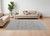 7' X 10' Ivory Taupe and Blue Floral Power Loom Worn Faded Area Rug With Fringe