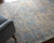9' X 12' Gray Blue and Tan Abstract Hand Woven Distressed Area Rug With Fringe