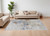 7' X 10' Red Blue and Ivory Abstract Power Loom Area Rug