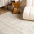 5' X 8' Beige and Black Checkered Power Loom Distressed Area Rug