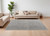 7' X 10' Ivory Tan and Blue Abstract Power Loom Worn Faded Area Rug With Fringe