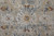 7' X 10' Ivory Tan and Blue Abstract Power Loom Worn Faded Area Rug With Fringe