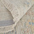 5' X 8' Tan Brown and Blue Floral Hand Woven Distressed Area Rug With Fringe