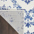 7' X 10' Ivory and Navy Blue Damask Distressed Non Skid Area Rug