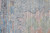 9' X 12' Orange Blue and Gold Floral Hand Woven Distressed Area Rug With Fringe
