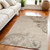 5' X 7' Tan Black and Ivory Damask Non Skid Area Rug