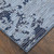 7' X 10' Light Blue and Black Abstract Power Loom Area Rug