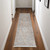 8' Gray Ivory and Orange Oriental Power Loom Worn Faded Runner Rug With Fringe