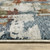 10' X 13' Beige Rust And Teal Abstract Distressed Area Rug With Fringe