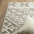 5' X 8' Beige And Brown Tribal Area Rug