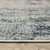 5' X 8' Beige And Blue Abstract Distressed Area Rug With Fringe