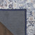 9' X 12' Blue and Ivory Floral Power Loom Distressed Washable Area Rug