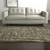 5' X 8' Green And Tan Abstract Area Rug