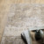 10' X 13' Beige Grey Ivory Tan And Brown Abstract Power Loom Stain Resistant Area Rug