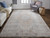 10' Gray Ivory and Orange Oriental Power Loom Runner Rug With Fringe