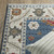 8' X 11' Blue And Ivory Floral Area Rug With Fringe