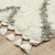 5' X 8' Ivory Gray And Tan Diamond Shag Area Rug With Fringe