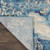 9' X 12' Turquoise Cream and Navy Blue Floral Distressed Area Rug