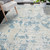 10' X 14' Ivory And Sky Blue Abstract Area Rug