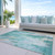 3' X 5' Teal Blue Peach And Ivory Abstract Washable Indoor Outdoor Area Rug
