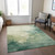 5' X 8' Green And Ivory Abstract Washable Indoor Outdoor Area Rug