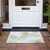 2' X 3' Green and Ivory Abstract Washable Non Skid Indoor Outdoor Area Rug