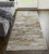 Homeroots Home Decor 12' Tan and Ivory Abstract Power Loom Distressed Runner Rug