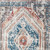2' X 3' Teal Taupe and Rust Geometric Distressed Area Rug With Fringe