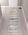 10' Cream Black And Gray Geometric Shag Runner Rug