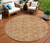8' Terra Cotta Copper And Beige Round Geometric Washable Indoor Outdoor Area Rug