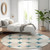 8' Teal Blue Beige And Ivory Round Abstract Washable Indoor Outdoor Area Rug