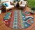 8' Red Pink And Teal Blue Round Aztec Washable Indoor Outdoor Area Rug