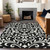 10' X 14' Black And Ivory Floral Washable Indoor Outdoor Area Rug