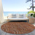 8' Orange Gold And Ivory Round Geometric Washable Indoor Outdoor Area Rug