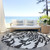 8' Black Gray And Ivory Round Animal Print Washable Indoor Outdoor Area Rug