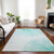9' X 12' Aquamarine And Ivory Abstract Washable Indoor Outdoor Area Rug
