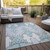9' X 12' Mint Green Teal Blue And Ivory Ikat Washable Indoor Outdoor Area Rug