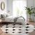 8' Black Gray And Ivory Round Abstract Washable Indoor Outdoor Area Rug