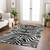 9' X 12' Black And Ivory Animal Print Washable Indoor Outdoor Area Rug